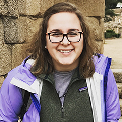 Maddie Henricksen in a purple coat smiling