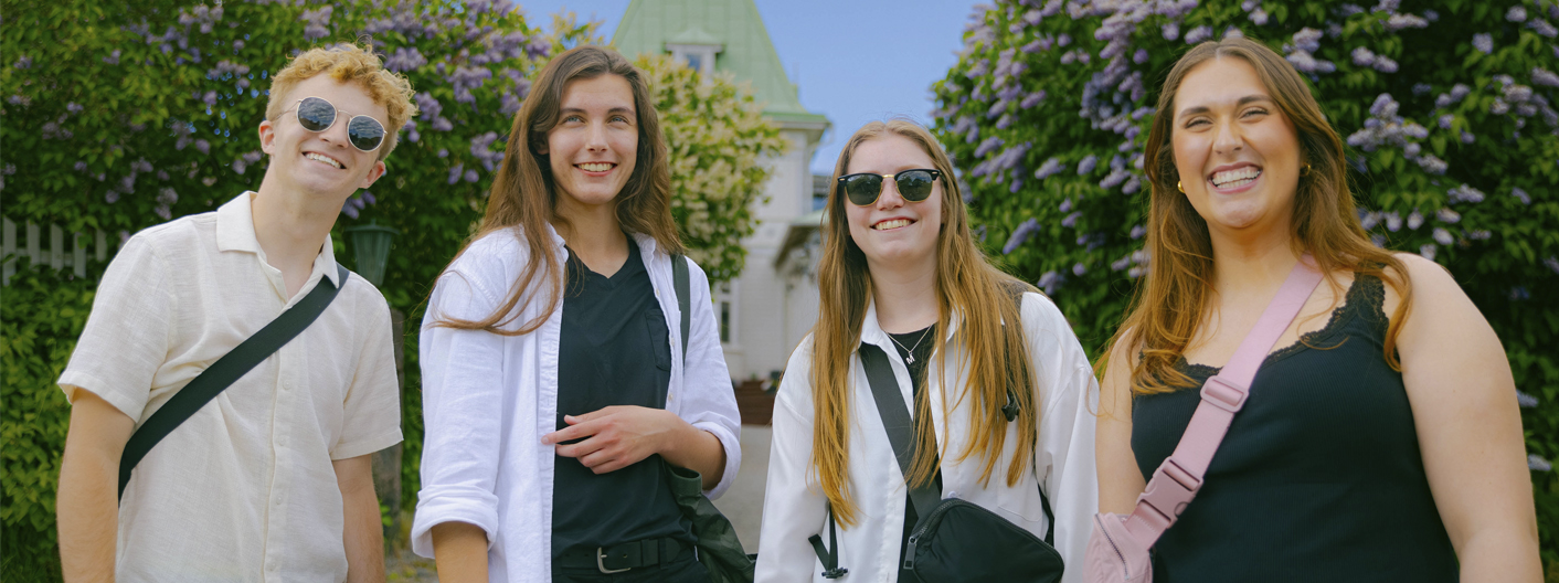Four students smile while studying abroad