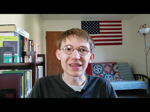 Zachariah Watt sits in his apartment talking to his web camera