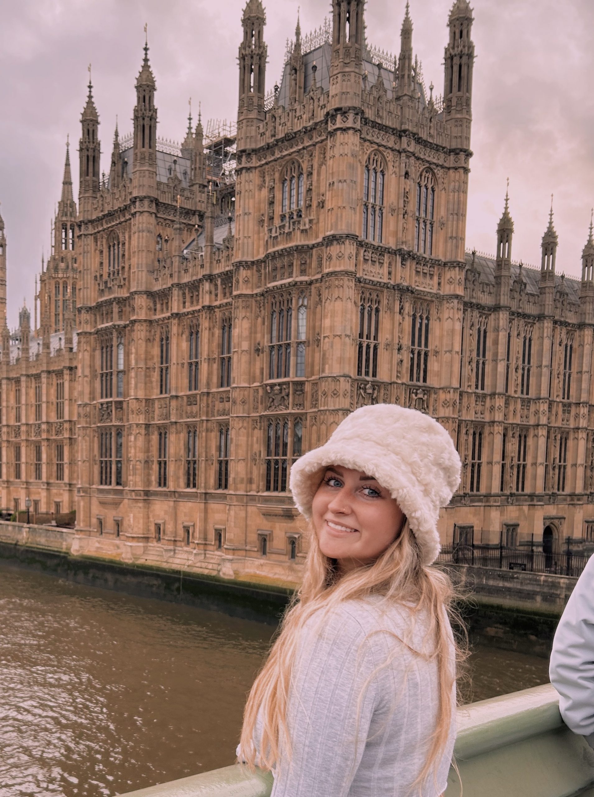 Isabella Sterling smiling while visiting the UK Parliament building