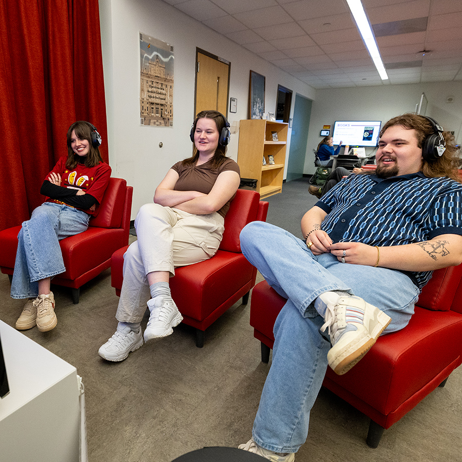 Three students watching a monitor in the LSRC